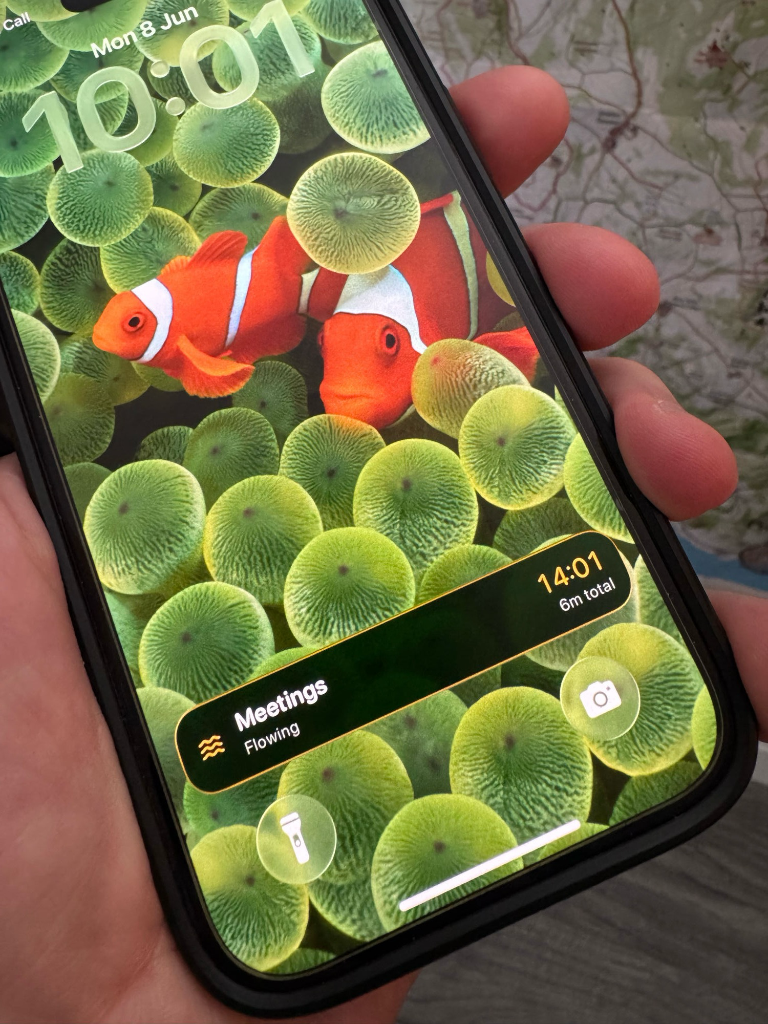 Lock Screen with a Flows Live Activity showing the active flow and elapsed time